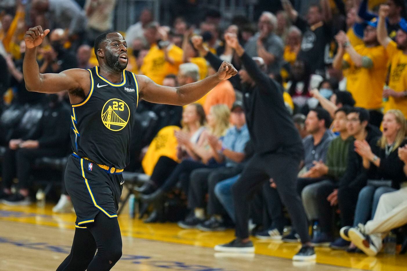 Golden State Warriors forward Draymond Green (23) celebrates a basket during the first...