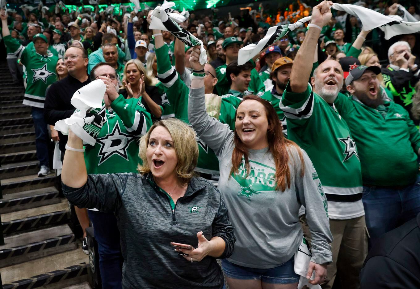 Dallas Stars fans cheer after a first period goal against the Calgary Flames in Game 6 of a...