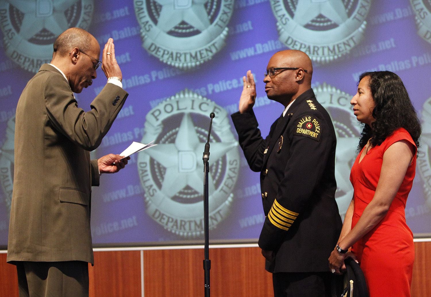 Larry Baraka (left), retired from the bench at the time, swore in former Dallas Police Chief...