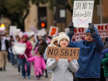 Demonstrators march in opposition to Texas Senate Bills 147 and 552 on Sunday, Jan. 29,...