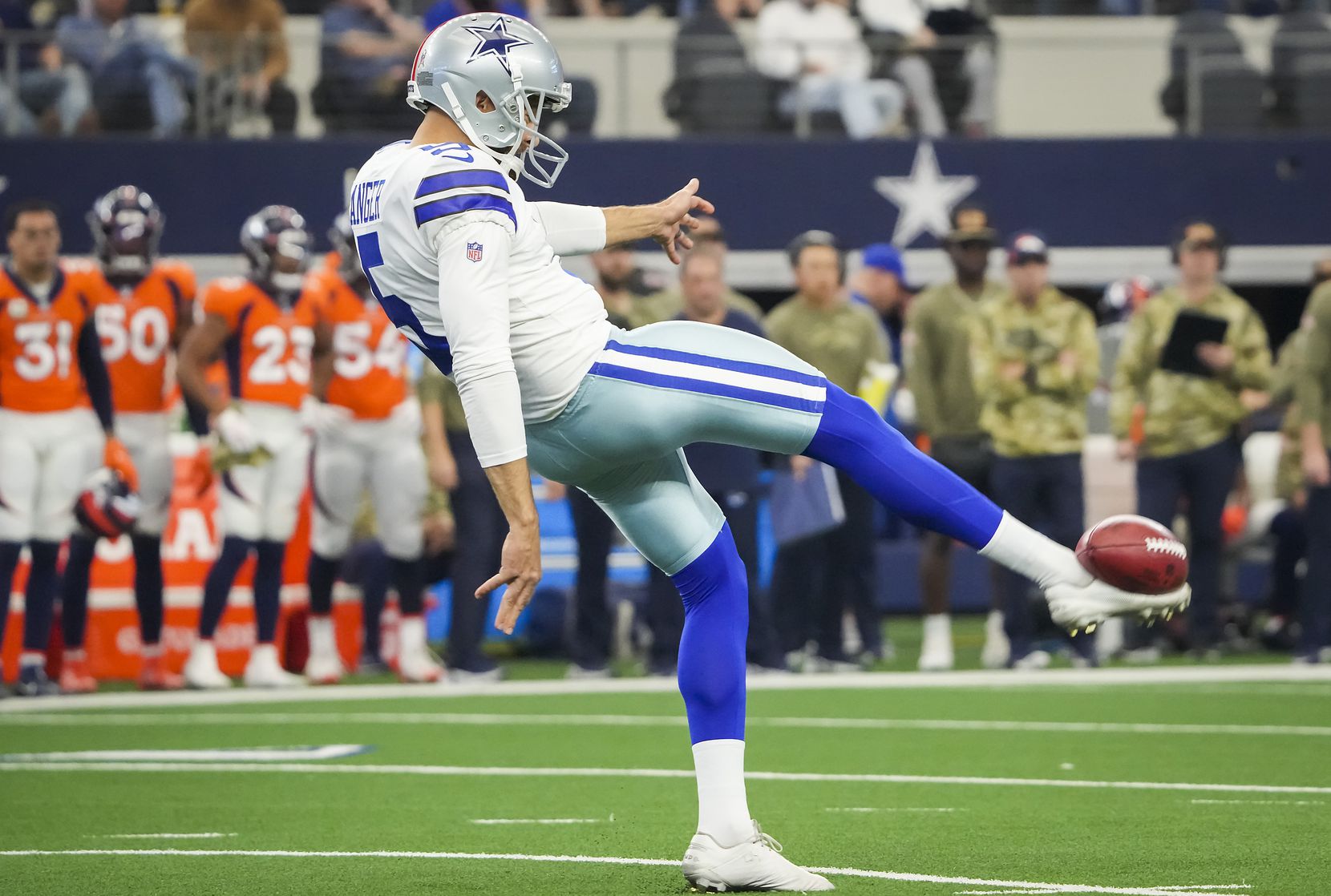 Dallas Cowboys punter Bryan Anger (5) punts the ball during the first half of an NFL...