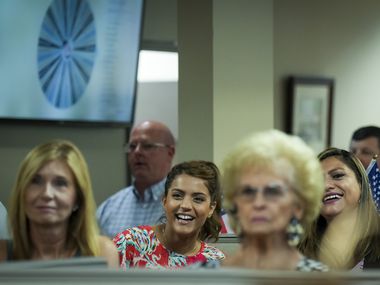 Realtors and staff listen to a speaker during the sales meeting in Grapevine.