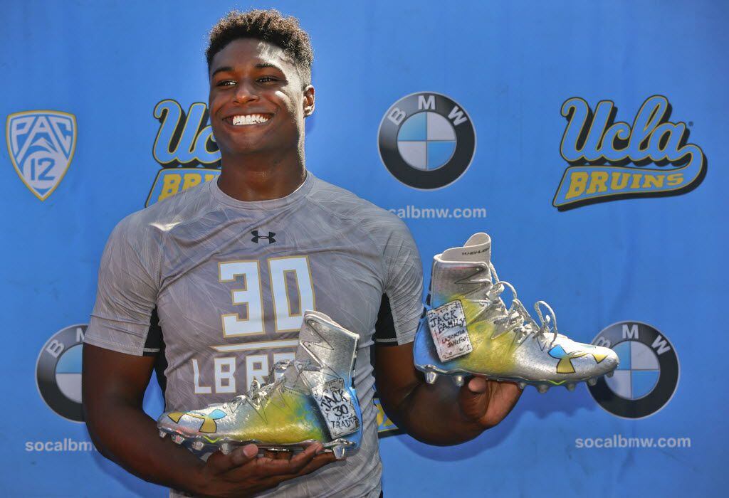 UCLA linebacker Myles Jack poses with his self-designed "Jack of all Trades" shoes at NLF...