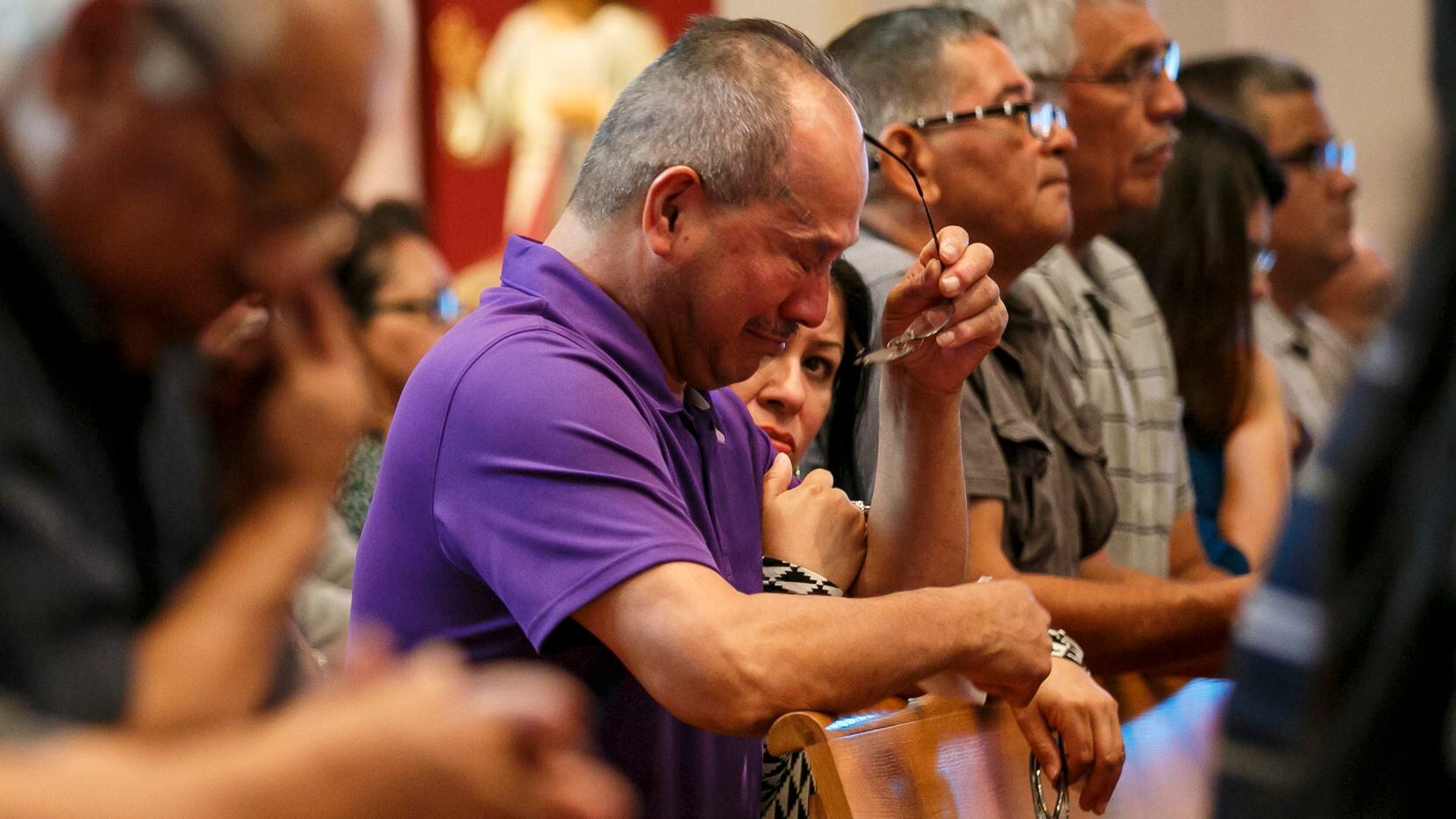 Rick Zamarripa, father of slain police officer Patrick Zamarripa, weeps during Mass at All...
