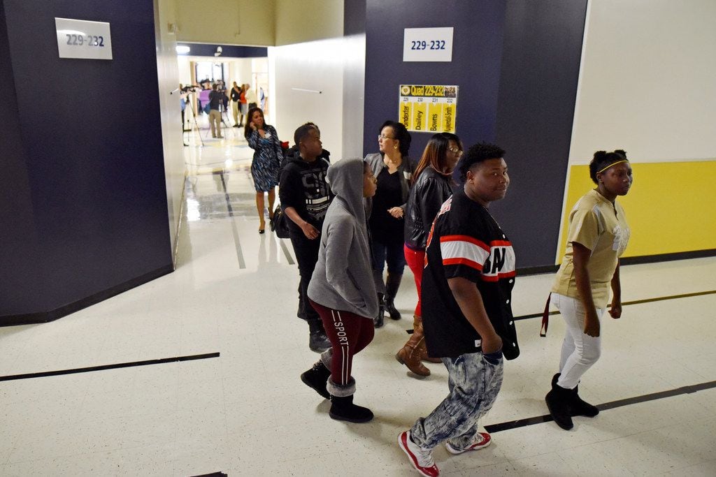 Students and parents browse the halls of the new South Oak Cliff High School at Village Fair...