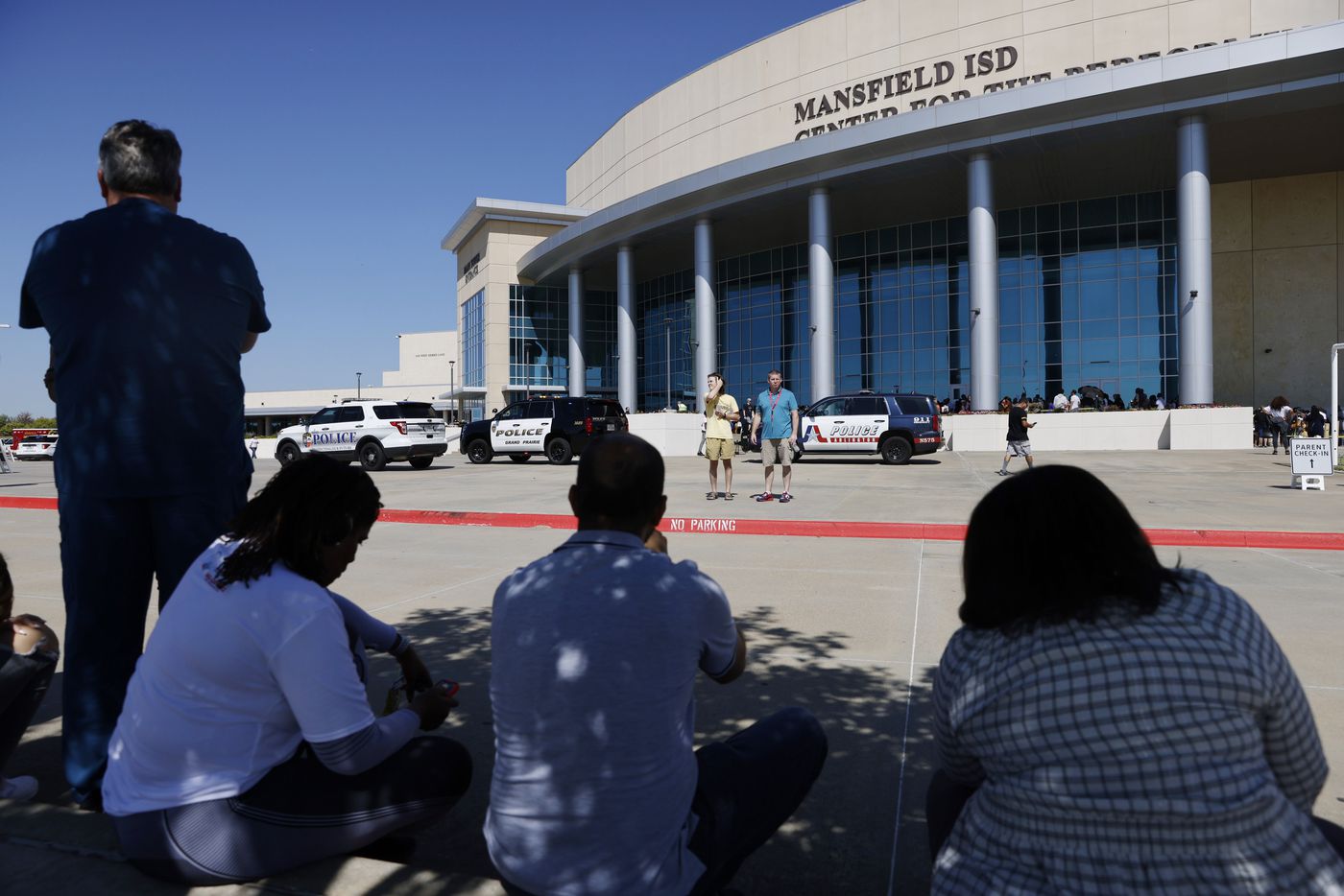 Parents of Timberview High School students wait outside of the Mansfield ISD Center for The...