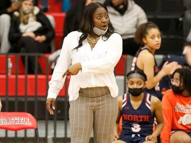 McKinney North High School head coach Veronica Hamilton sends a message to her player during...