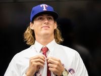Texas Rangers 4th round pick, pitcher Mason Englert  of Forney (TX) High School, dons a...