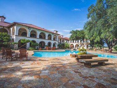 The centerpiece ranch house has a huge pool and outdoor living areas.