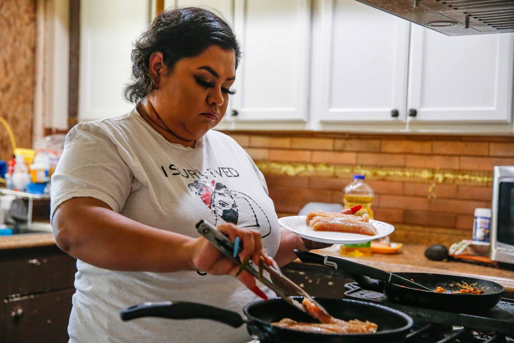 Veloz prepares lunch for her son at their home in Grand Prairie on Dec. 10, 2020.