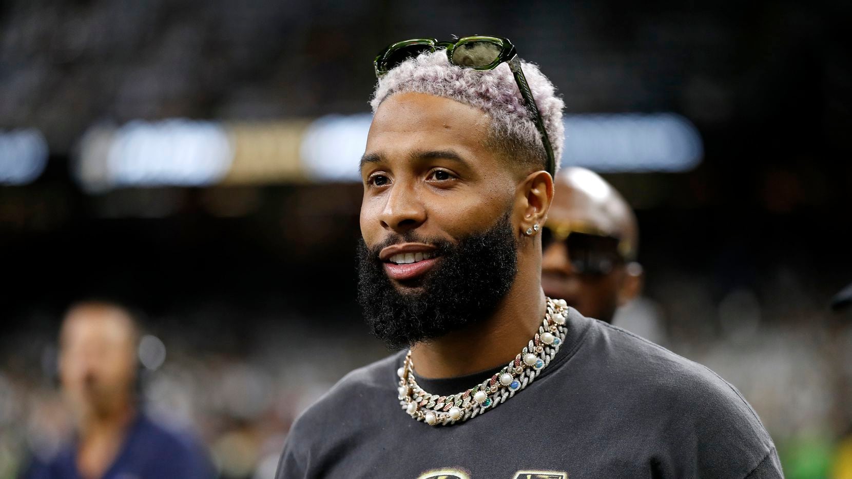 Odell Beckham Jr. is seen on the sidelines before an NFL football game between the New...