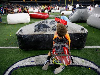 Kyson Henderson, 9, fires a Nerf gun during Jared's Epic Nerf Battle 2 at AT&T Stadium in...