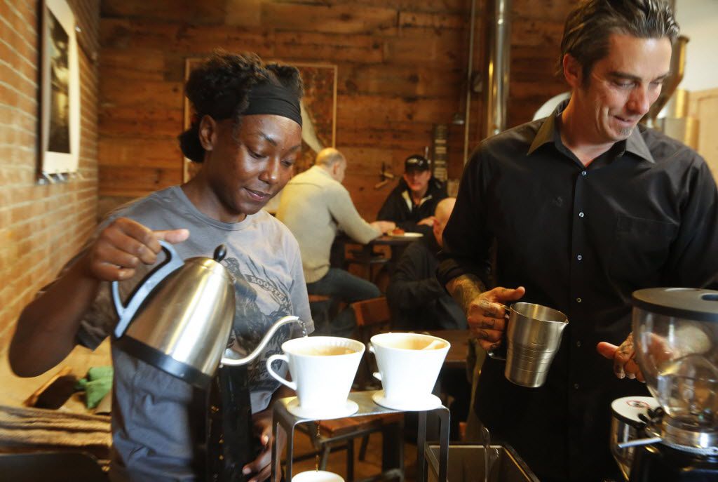 Alexandria Gilbert, left, and Michael Wyatt prepare coffee for customers at Full City...