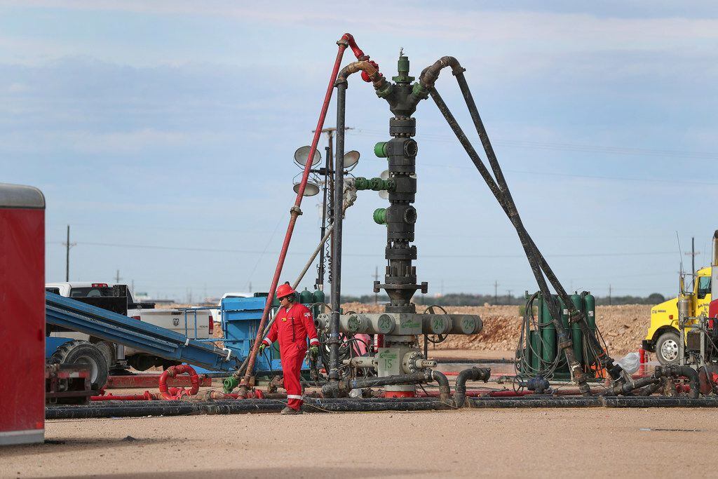 In a Monday, June 26, 2017 photo, a Halliburton wellhead is visible at a fracking site in...