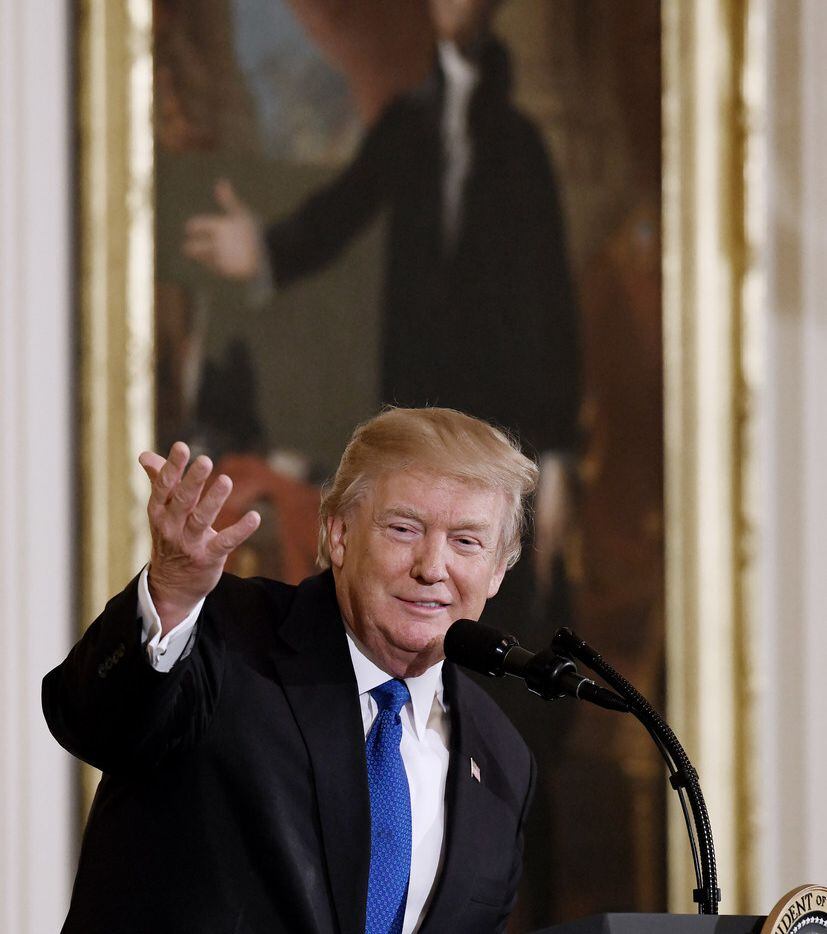 U.S. President Donald Trump addresses mayors during a working session in the East Room of...