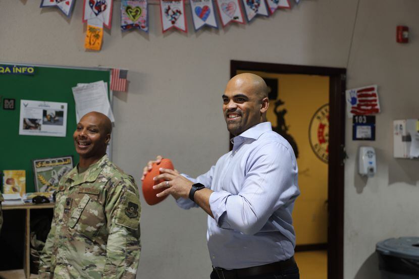 Rep. Colin Allred, D-Dallas, throws a football at Camp Arifjan in Kuwait. Allred visited the...