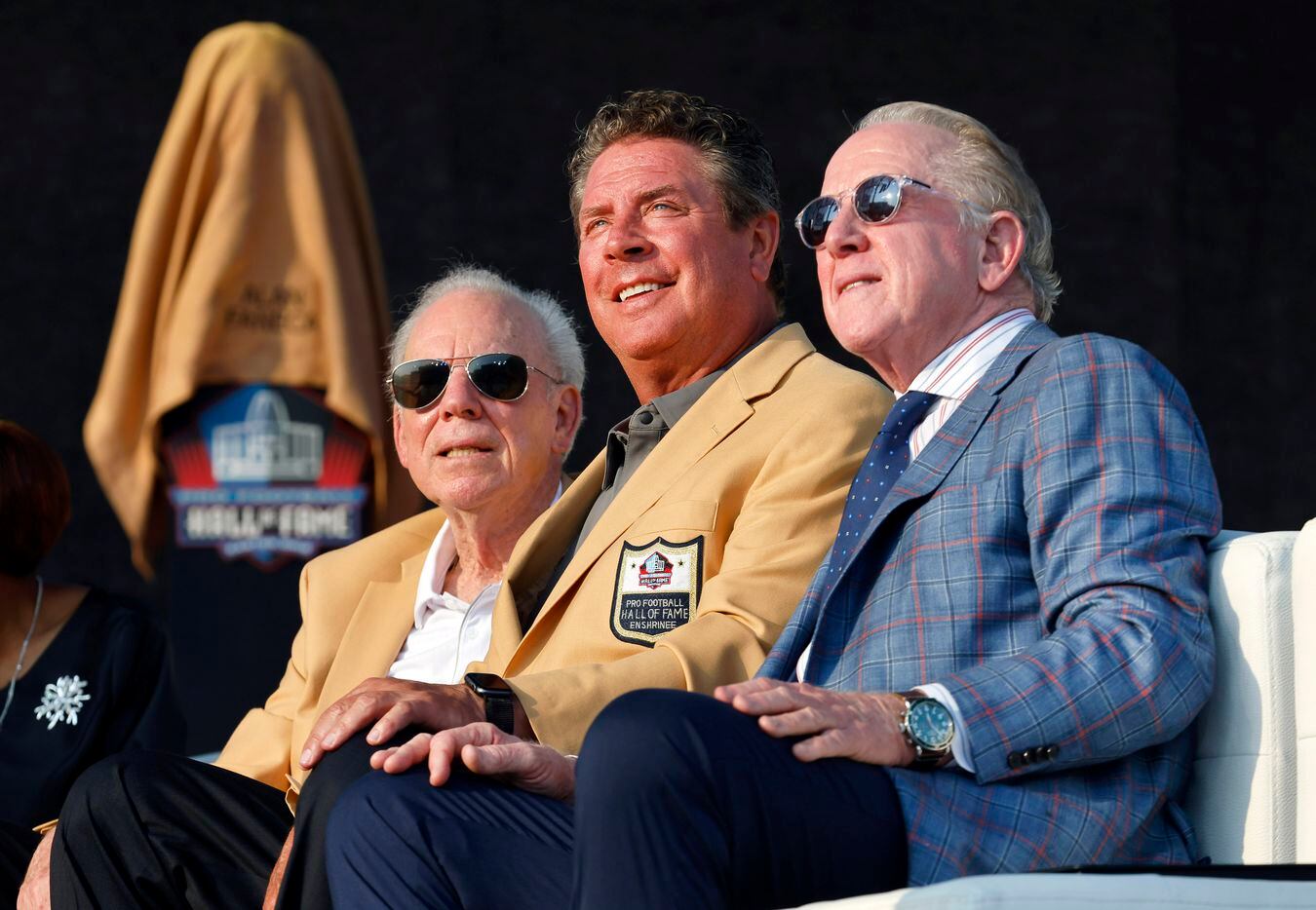 Pro Football Hall of Fame quarterbacks Roger Staubach of the Dallas Cowboys (left), Dan Marino of the Miami Dolphins (center) and former New Orleans Saints quarterback Archie Manning pose for a photo before the Class of 2021 enshrinement ceremony at Tom Benson Hall of Fame Stadium in Canton, Ohio, Sunday, August 8, 2021. Manning was onstage as a presenter for his son, Peyton Manning. (Tom Fox/The Dallas Morning News)
