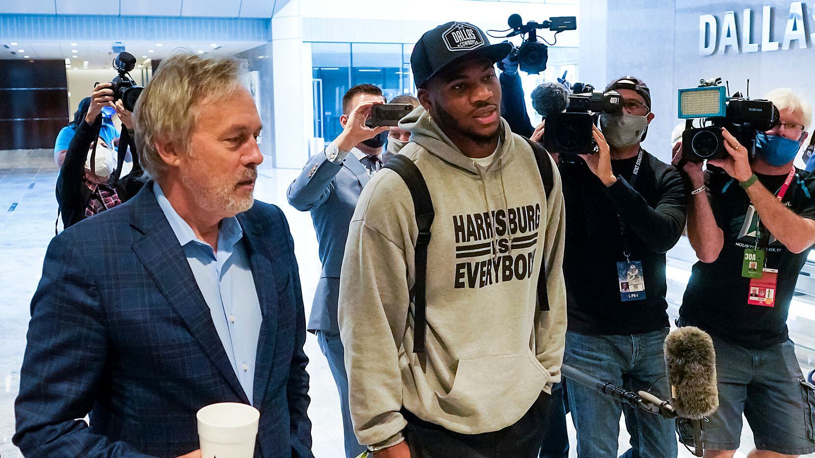 Dallas Cowboys first-round draft pick Micah Parsons gets a tour from senior vice president...