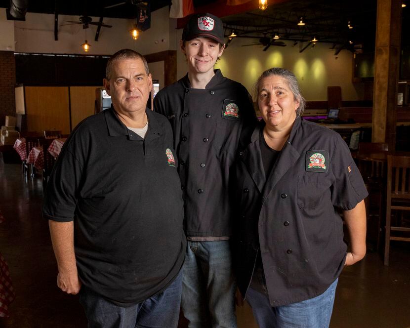 Old Hag’s founder Michael Lindsey stands with his son Stephen Lindsey and wife Carri Lindsey...