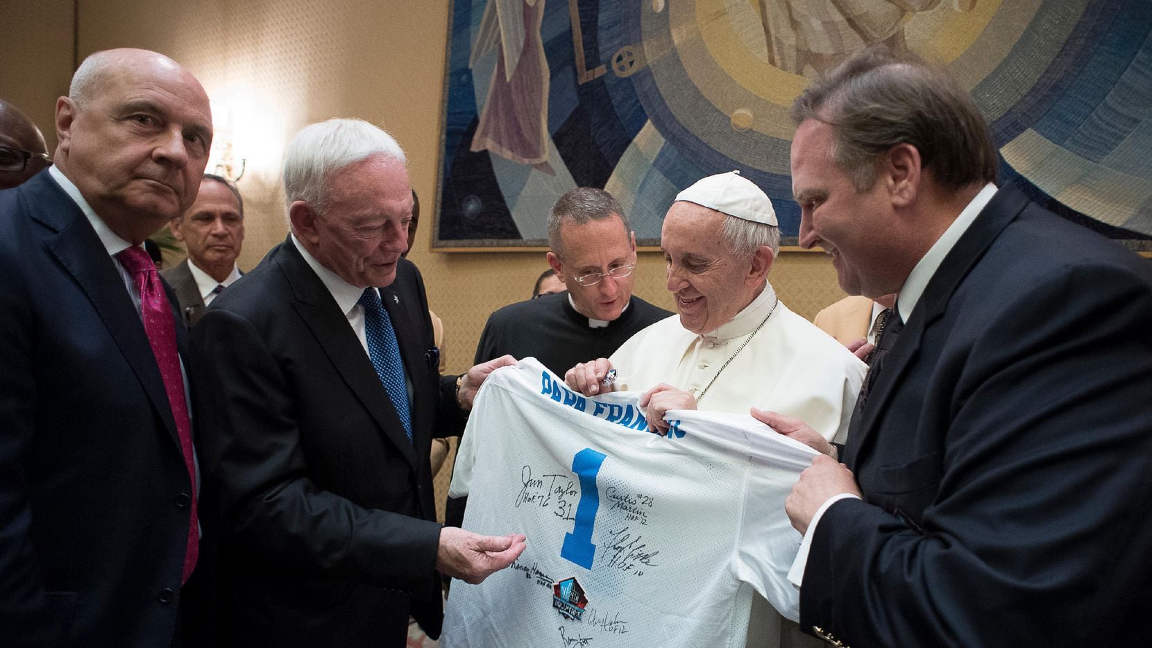 Pope Francis is presented with a Pro Football Hall of Fame jersey bearing his name by Dallas...
