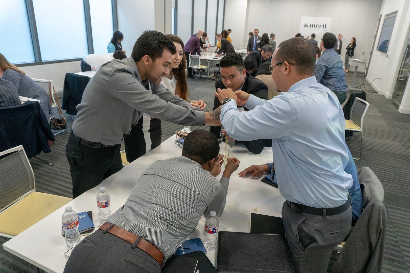 Merit America participants participate in a group activity during their cohort launch event.