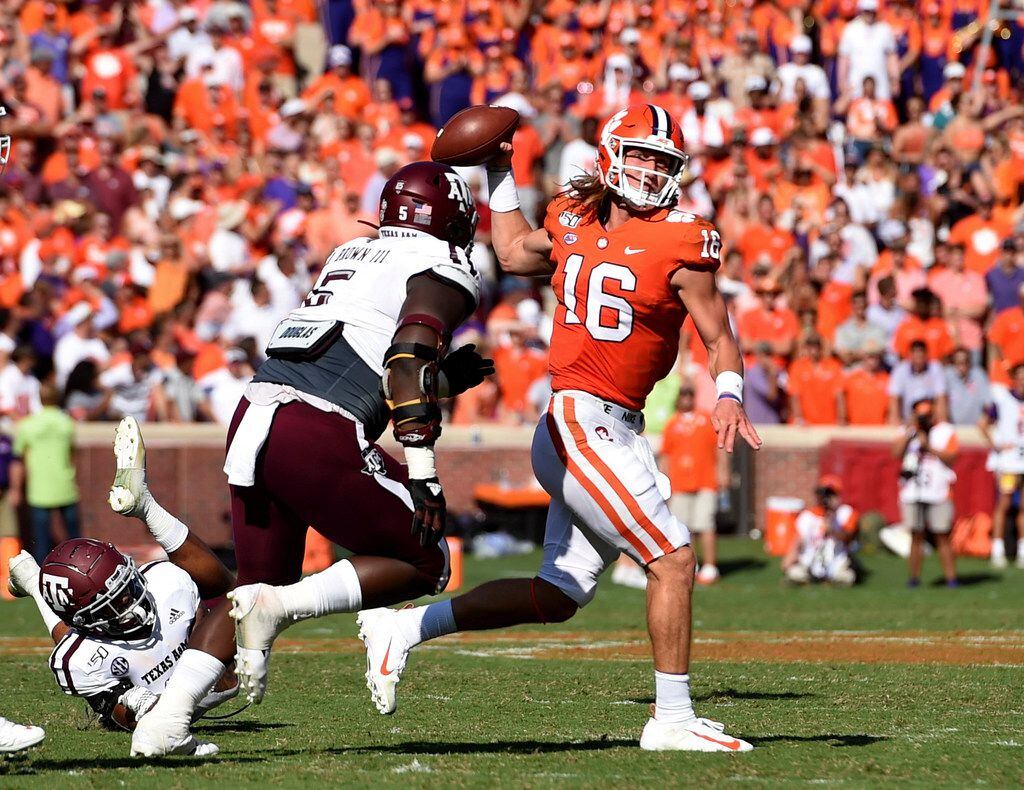 Clemson quarterback Trevor Lawrence (16) passes while pressured by Texas A&M's Bobby Brown during the first half of an NCAA college football game Saturday, Sept. 7, 2019, in Clemson, S.C.