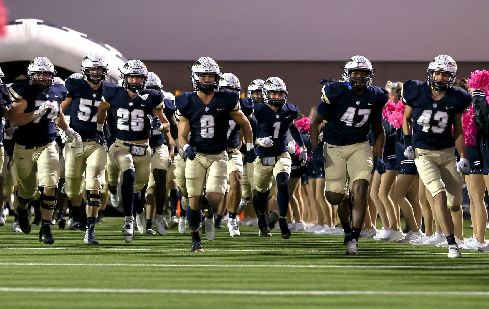 The Keller Indians enter the field to face Byron Nelson in a District 4-6A high school...