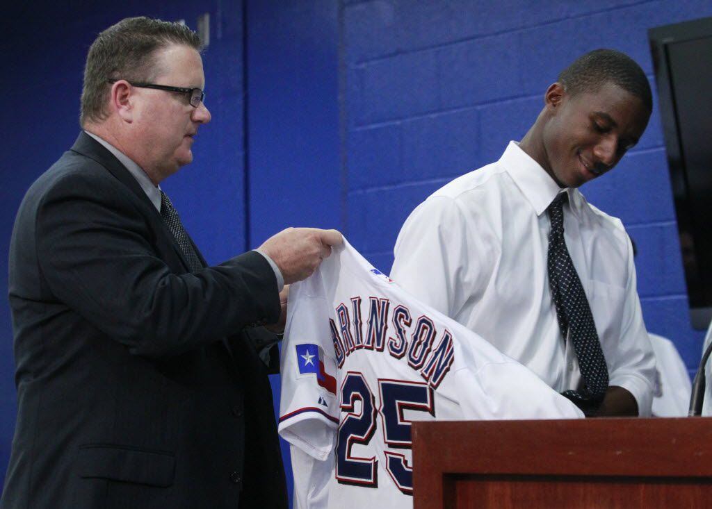 Kip Fagg, director of amateur scouting, helps Texas Rangers first round draft pick  Lewis...
