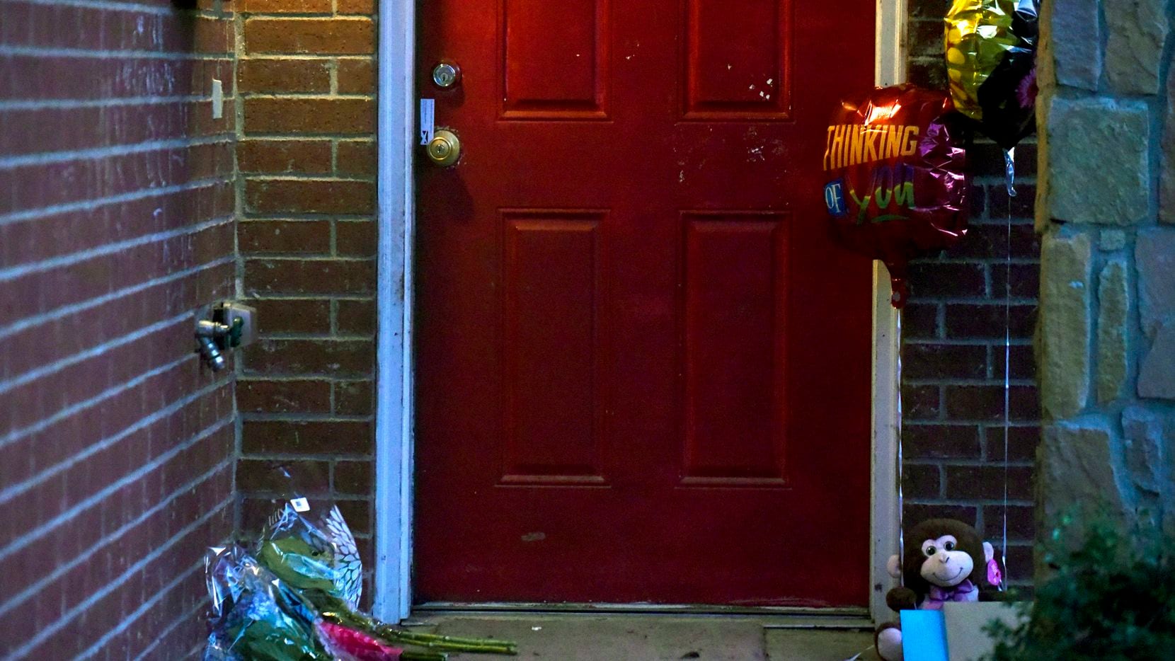 Flowers, balloons and cards have been placed outside of a home where 1-year-old boy Rory...