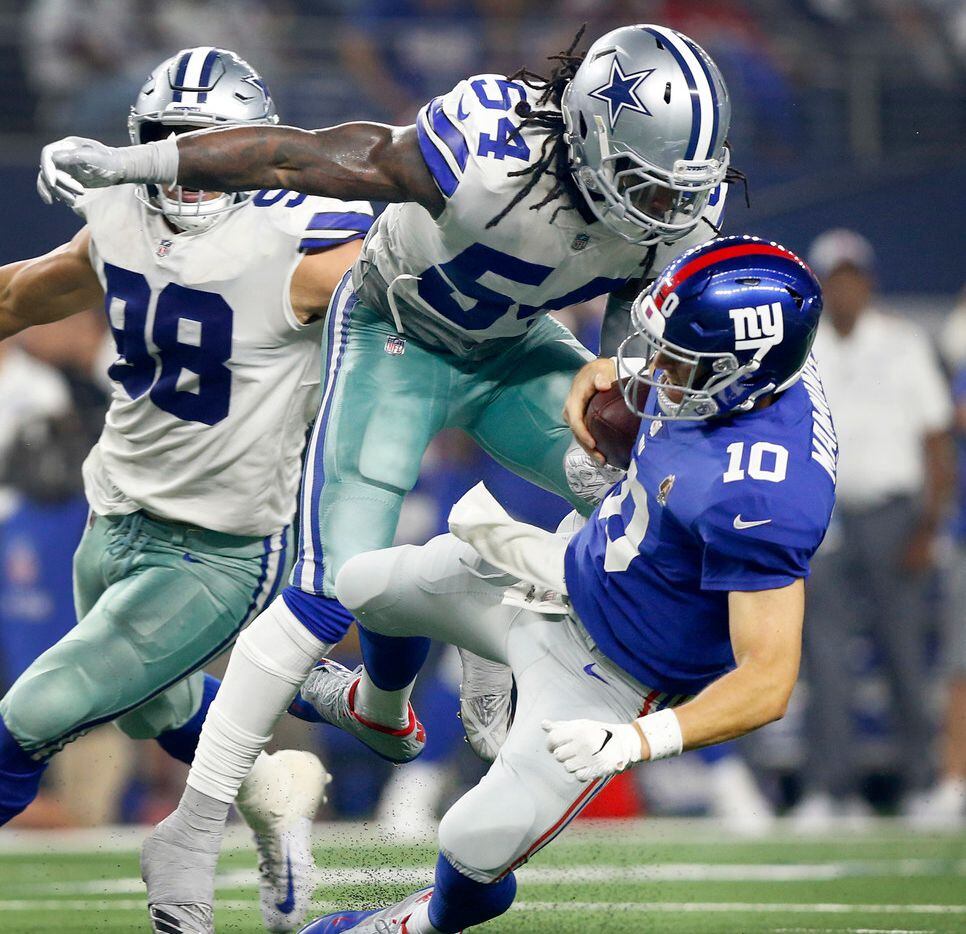 New York Giants quarterback Eli Manning (10) is hit hard and tackled by Dallas Cowboys linebacker Jaylon Smith (54) during the third quarter at AT&T Stadium in Arlington, Texas, Sunday, September 16, 2018. The Cowboys defeated the Giants, 20-13. (Tom Fox/The Dallas Morning News)