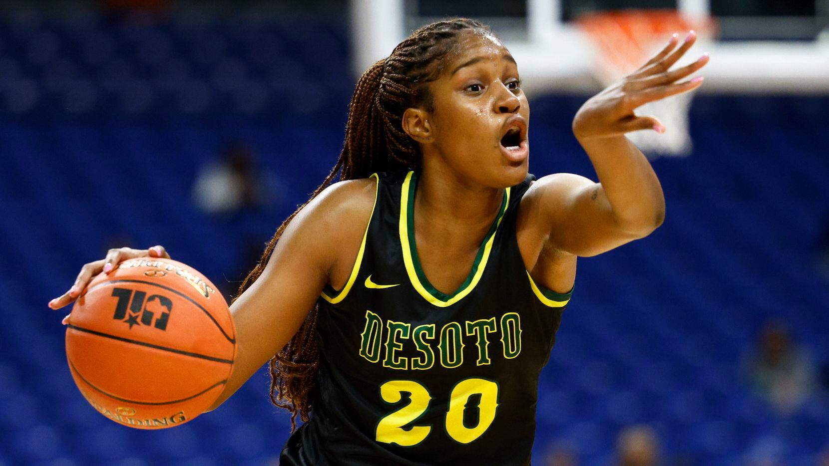 DeSoto guard Ayanna Thompson (20) directs her teammates during the first quarter of a Class...