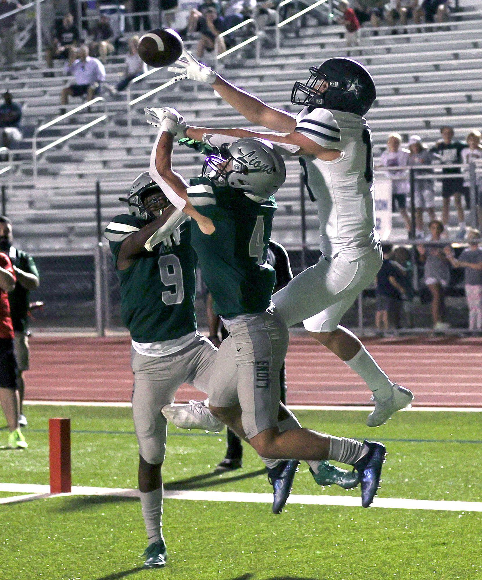 Frisco Lone Star wide receiver Chris Viveros (R) tries to come up with a reception against...