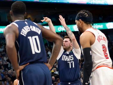 Dallas Mavericks guard Luka Doncic (77) shoots three free throws after being fouled in the...