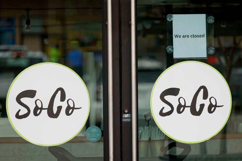 A closed sign remains on the door of SoCo Coffee House in Lake Highlands.