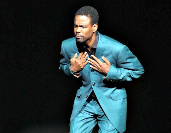 Comedian Chris Rock bows to the crowd at the start of his performance at Nokia Theatre in...