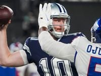 Dallas Cowboys quarterback Cooper Rush (10) throws a pass under pressure from New York...
