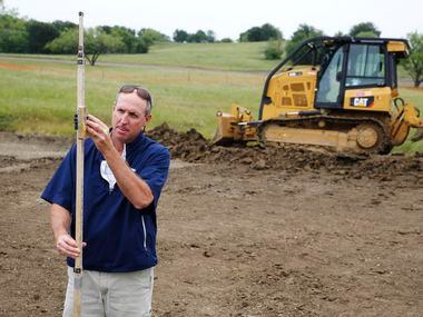 Design partner, Jim Wagner of Gil Hanse Design works on the 14th green of the East Course at...