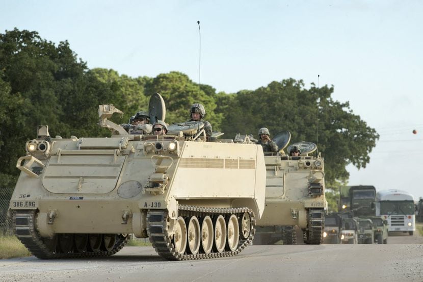 A convoy of National Guard troops moves on Camp Swift in July 2015 as part of the Operation...