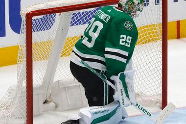 Dallas Stars goaltender Jake Oettinger (29) looks down at the ice after allowing an overtime...