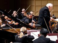 Edo de Waart (right) conducts the Dallas Symphony Orchestra as pianist Ingrid Fliter (left)...