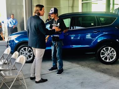 Ronald Wallace Lowenfield of Casa Ford Lincoln Nissan in El Paso presents Antonio Basco with...