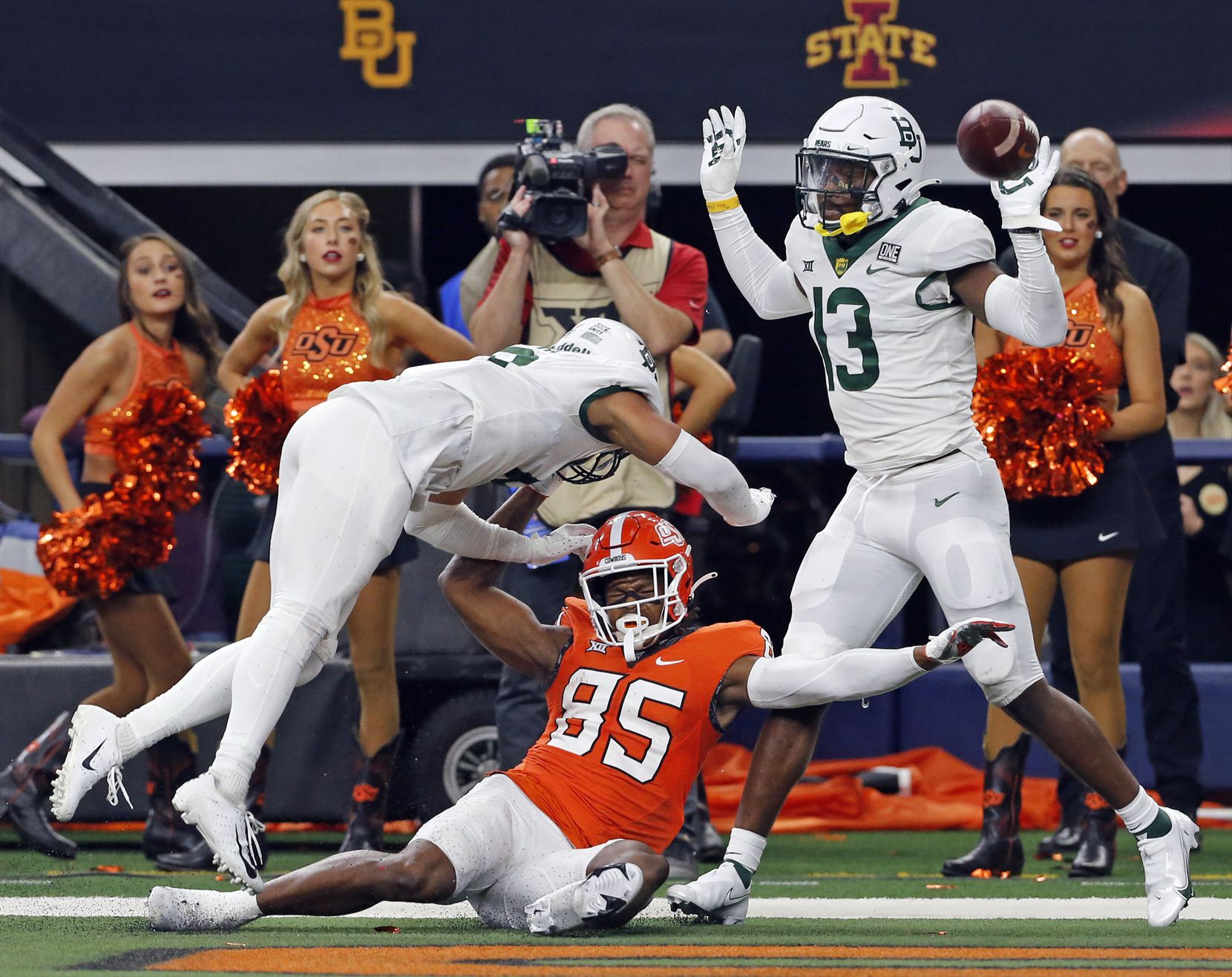 Baylor Bears safety Jalen Pitre (8) and Baylor Bears cornerback Al Walcott (13) manhandle Oklahoma State Cowboys wide receiver Jaden Bray (85) on a pass in the end zone (and were flagged on the play) during the second half of the Big 12 Championship football game at AT&T Stadium in Arlington on Saturday, December 4, 2021. Baylor won 21-16. (John F. Rhodes / Special Contributor)