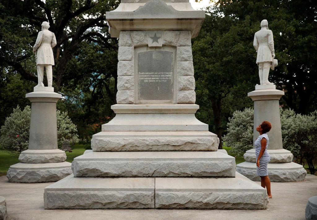 Victoria Miller of Dallas read an inscription last month on the Confederate War Memorial in...