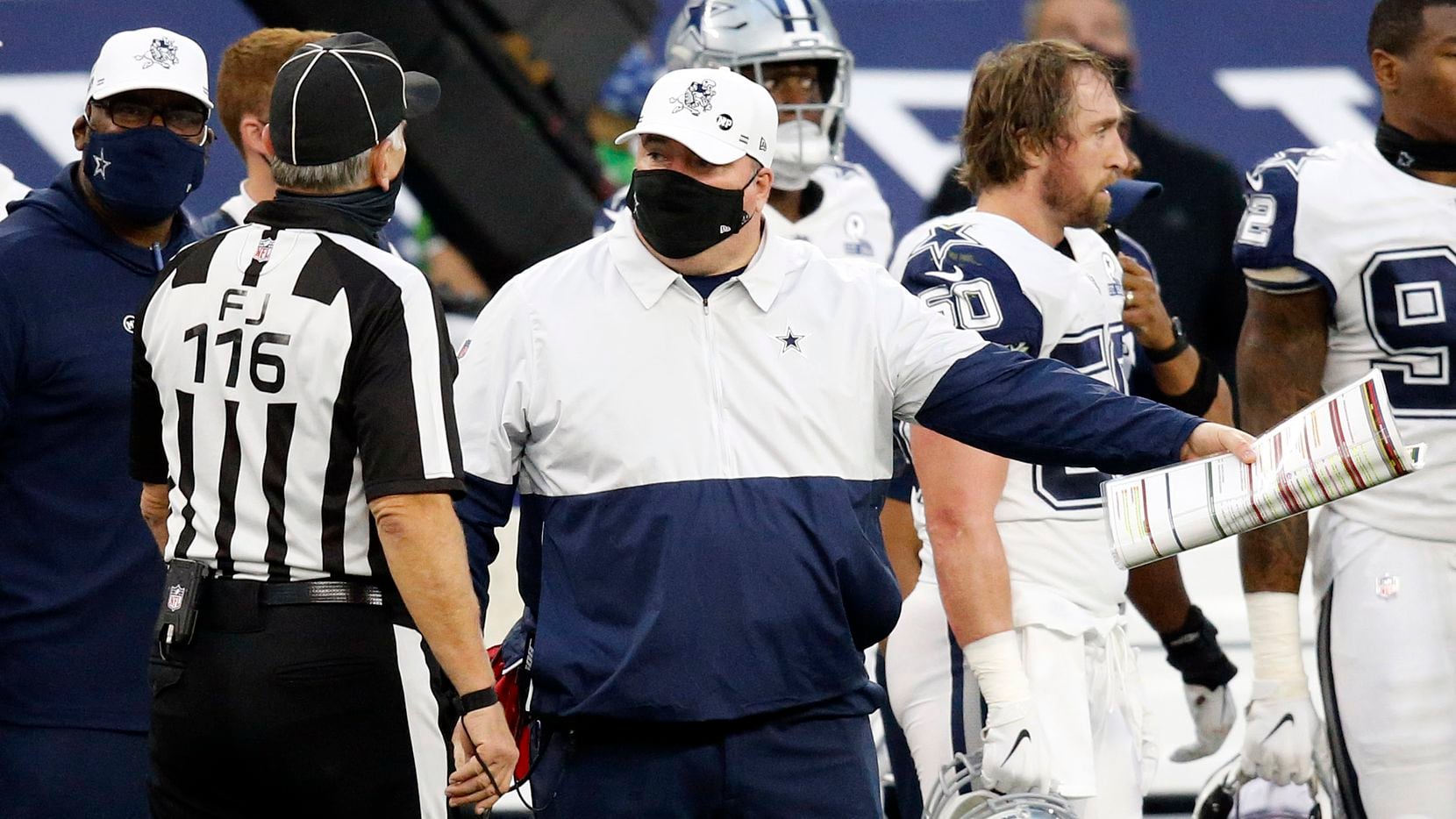 Dallas Cowboys head coach Mike McCarthy makes his case on a call with field judge Mike Weatherford (116) during the second quarter against the Washington Football Team at AT&T Stadium in Arlington, Thursday, November 26, 2020.