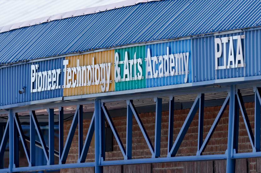 A sign for Pioneer Technology and Arts Academy charter school is seen after a student who...