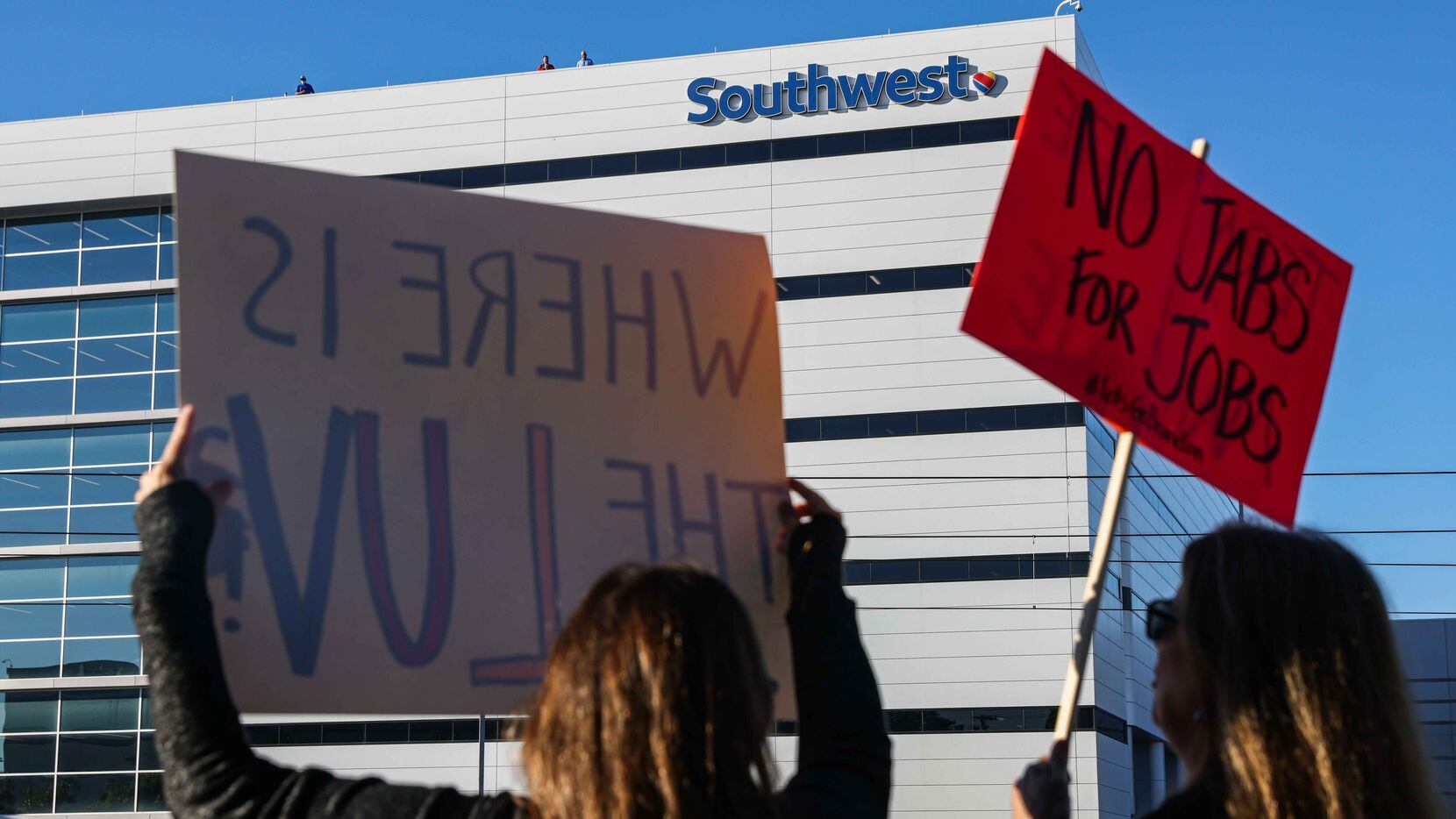 People gather to protest mandate on COVID-19 vaccines at Southwest Airlines headquartes in...