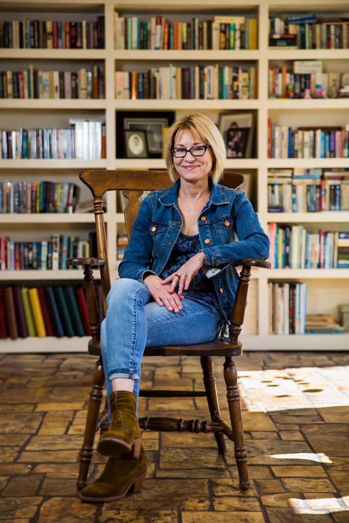 Author Elizabeth Crook poses for a portrait in her living room  in Austin.  