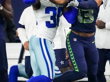 Dallas Cowboys cornerback DaRon Bland (30) breaks up a pass intended for Seattle Seahawks...