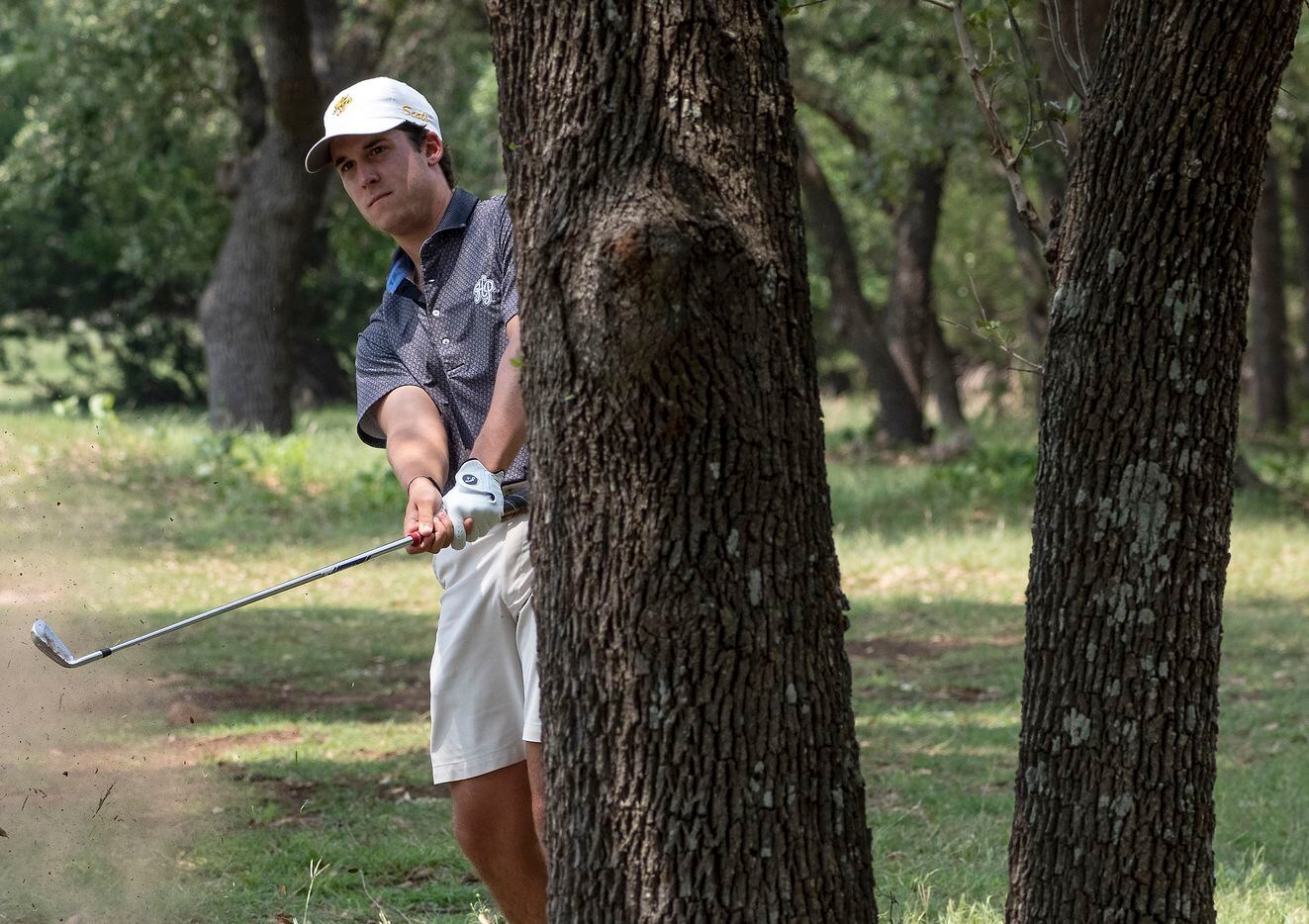 Highland Park, Joe Stover hits out of the rough on the no. 17 hole during the first round of...