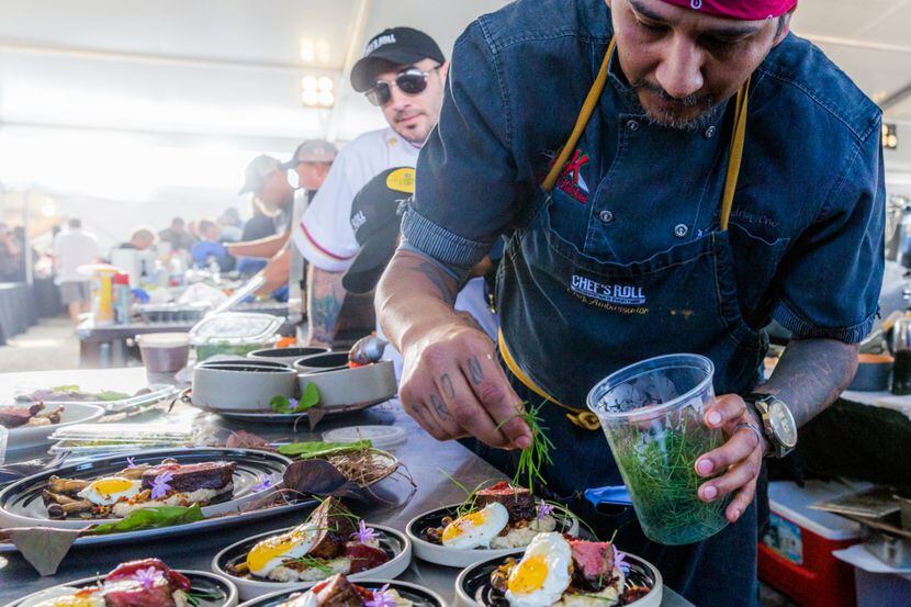 A chef prepares plates for judging at the World Food Championships. 